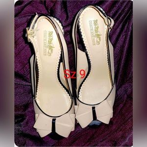 Brand: Coach and Four Size 9 but runs small more like an 8.5. Beige and Black